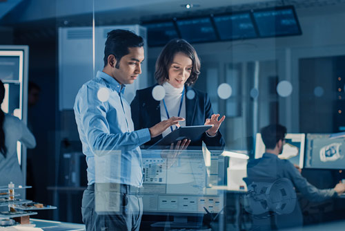 Two office workers solving a problem